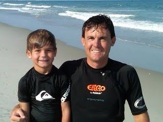 Father and Son Surfing Together