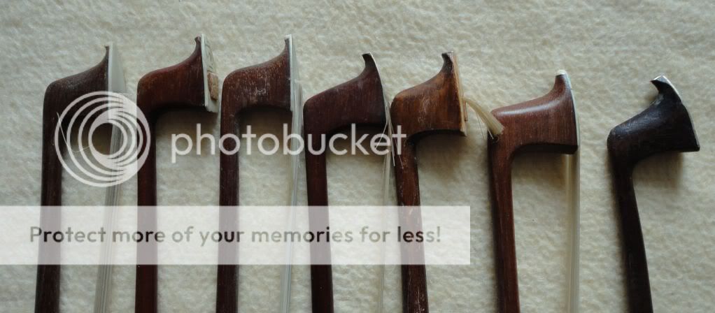 You are bidding for 7 old violin bows.